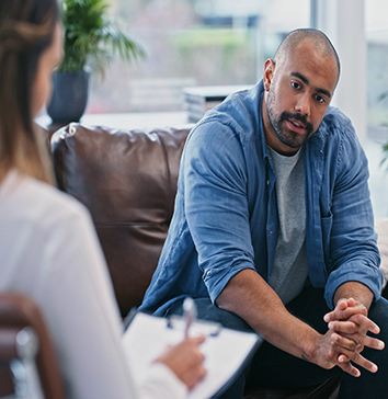 psychiatrist talking to patient